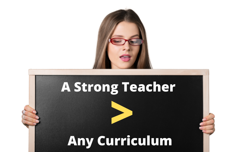 teacher with a chalkboard that says a strong teacher is greater than any curriculum