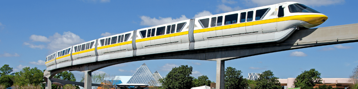 Walt Disney World yellow monorail moving through EPCOT