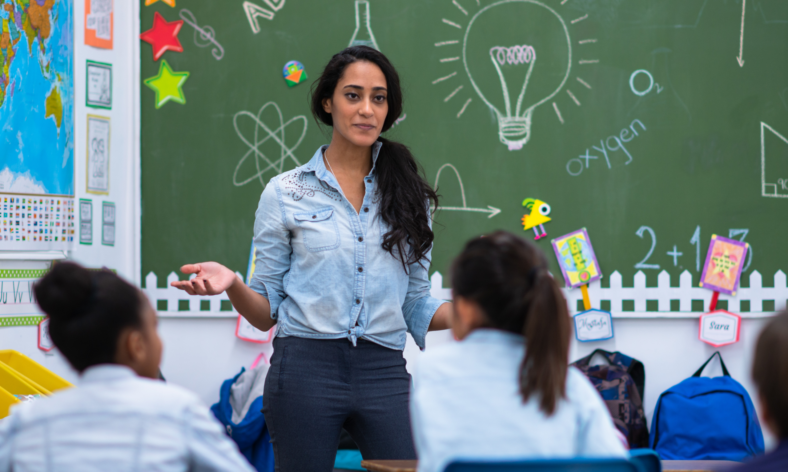 female science teacher in front of the class