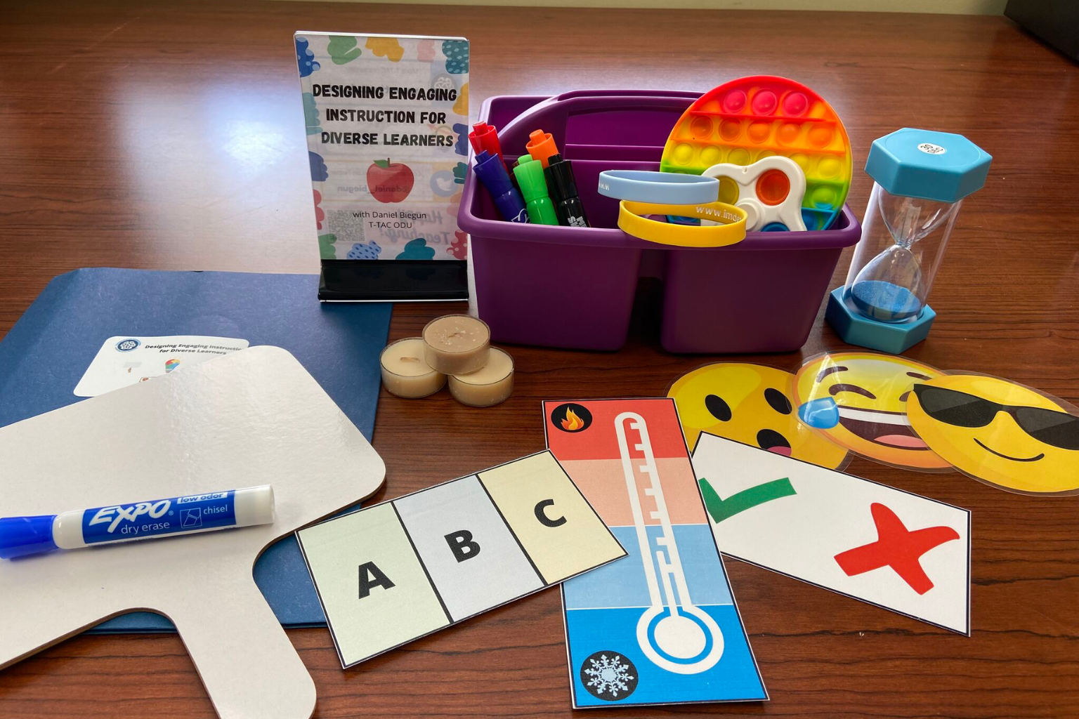 PD items: whiteboard, dry erase marker, table basket, sand timer, and pinch cards